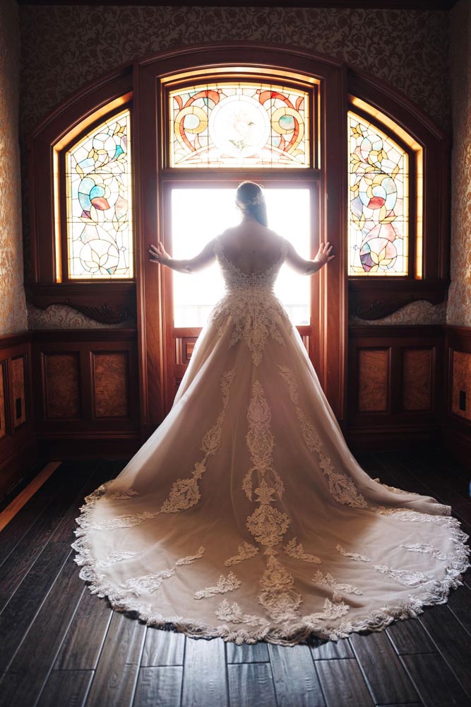 Bride in front of window